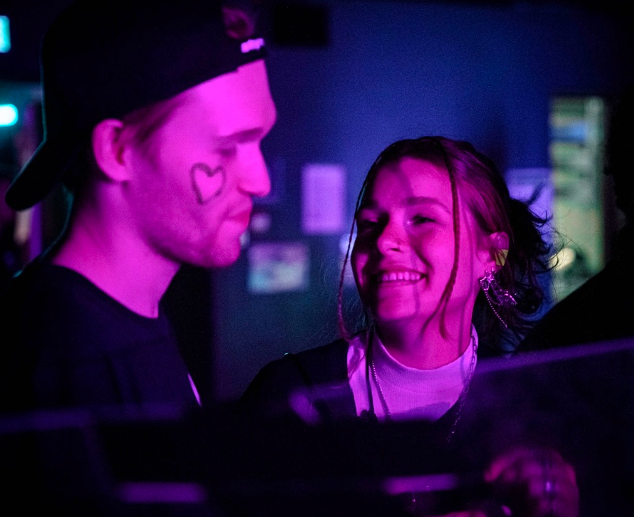 Closeup of a man and woman at a concert