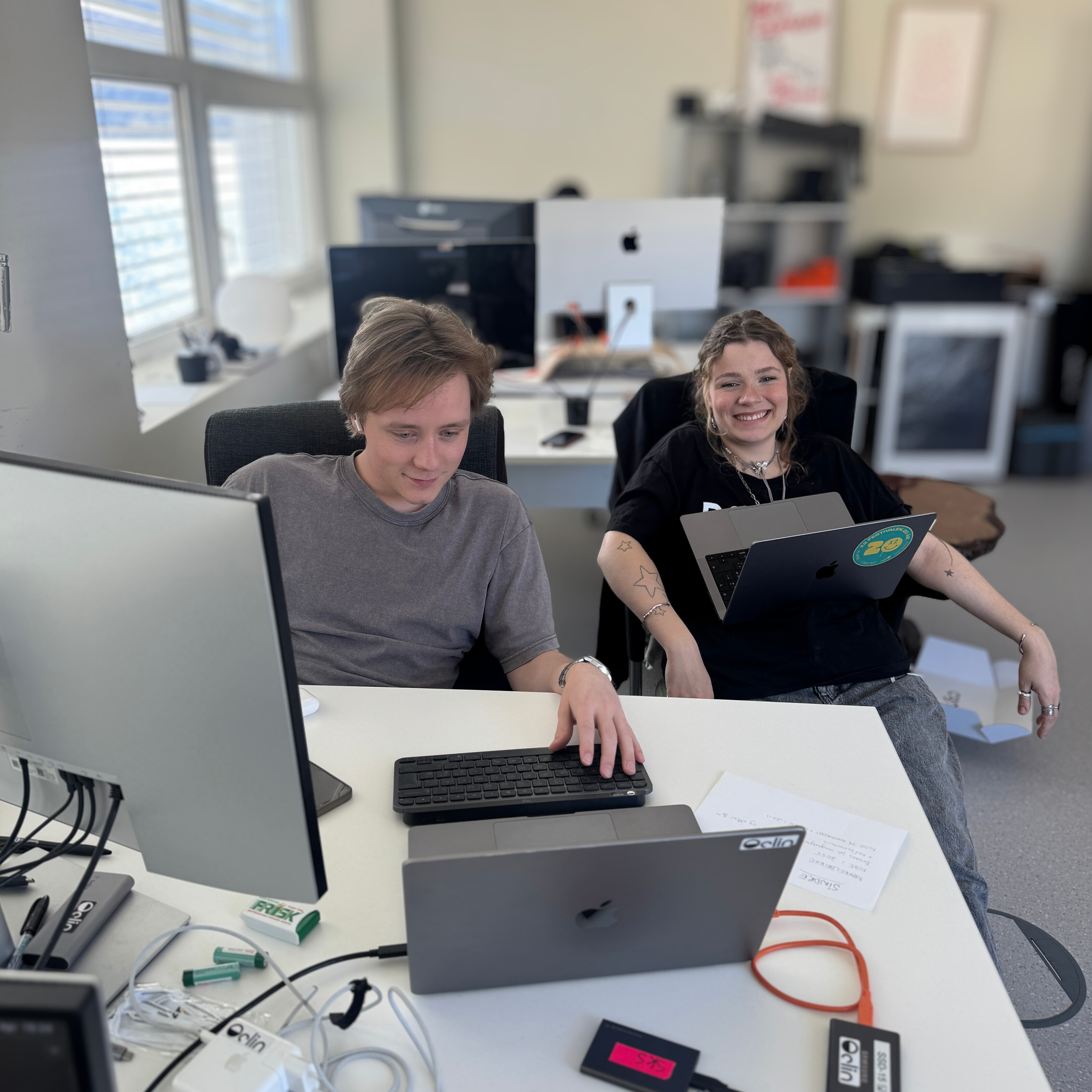 Man and woman working at their computers.
