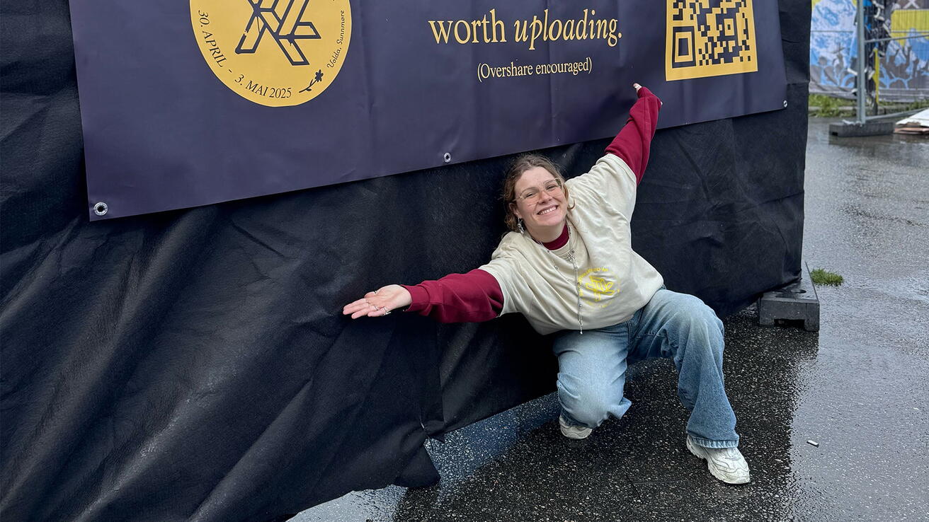Girl in front of a sign