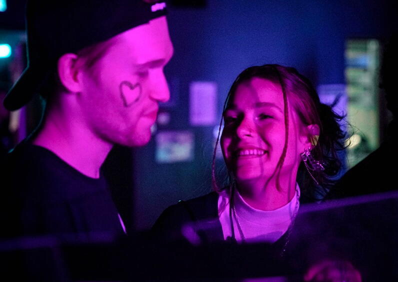 Closeup of a man and woman at a concert